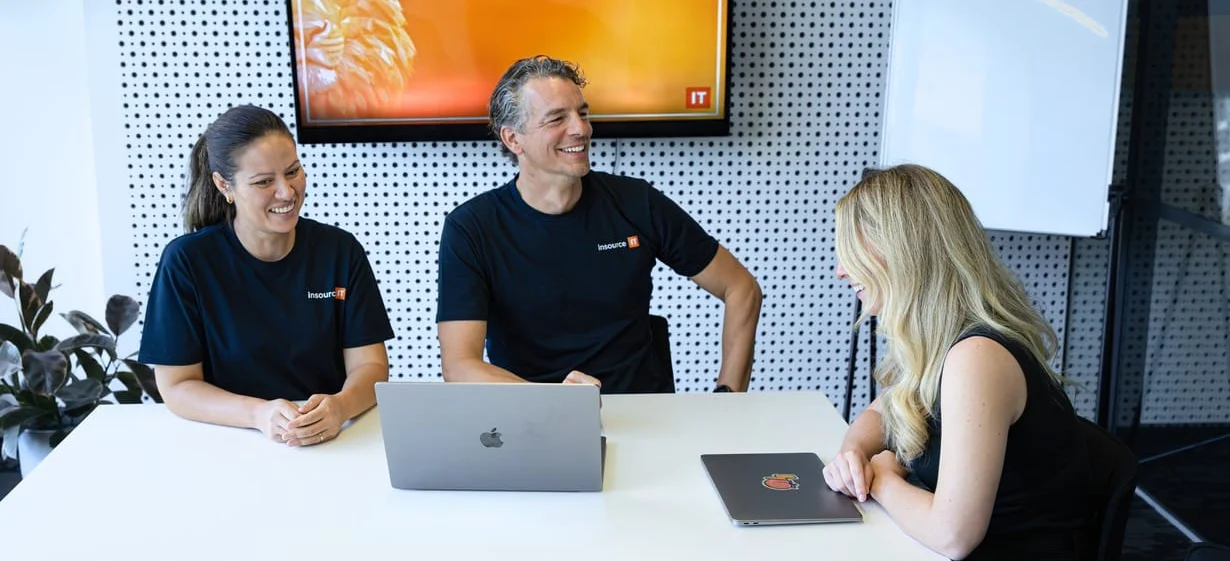 Insource IT team discussing cyber security frameworks in a client meeting