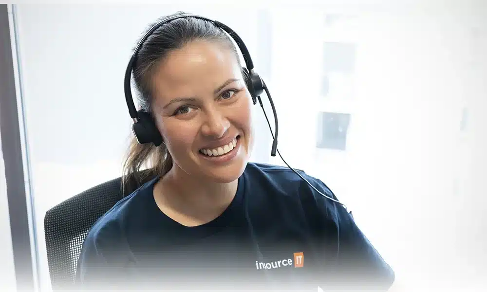 Insource IT service desk engineer on a headset